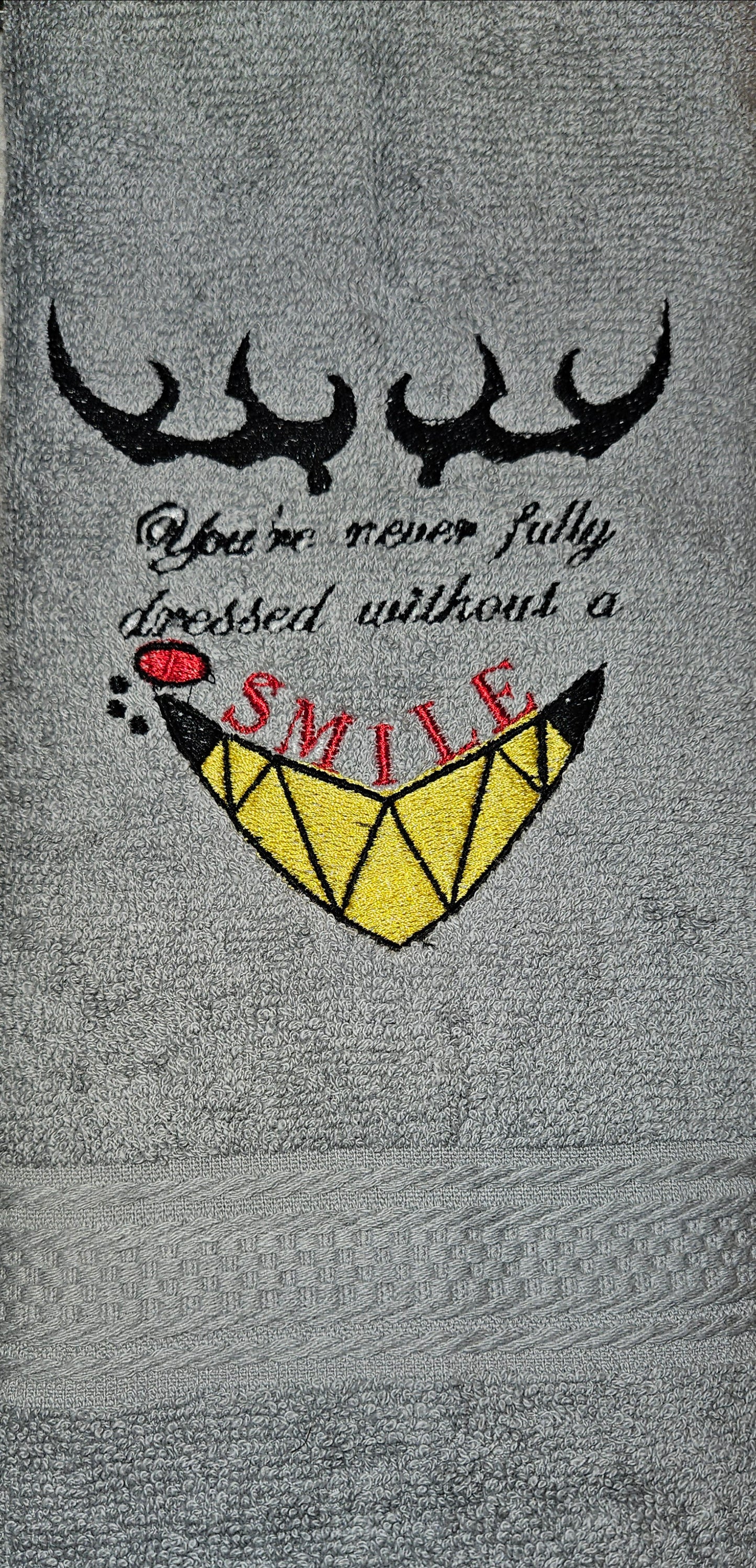 You're Never Fully Dressed Without A Smile Embroidered Hand Towel